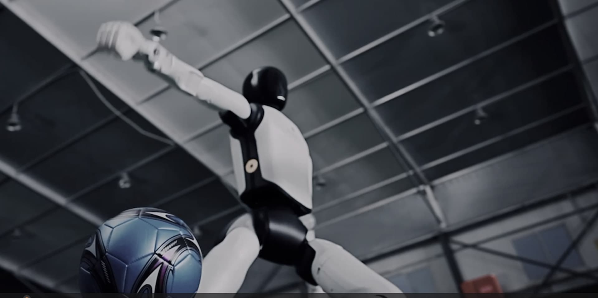 AGIBOT A3 demonstrating coordinated movement with a football
