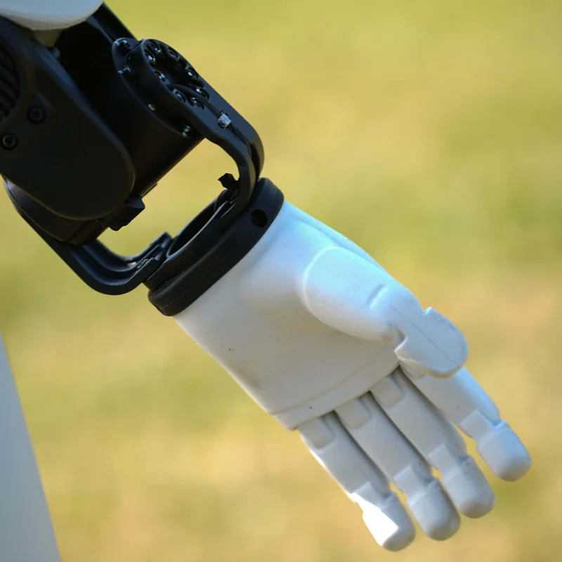 AGIBOT X2 hand and wrist extended outdoors during a field trial